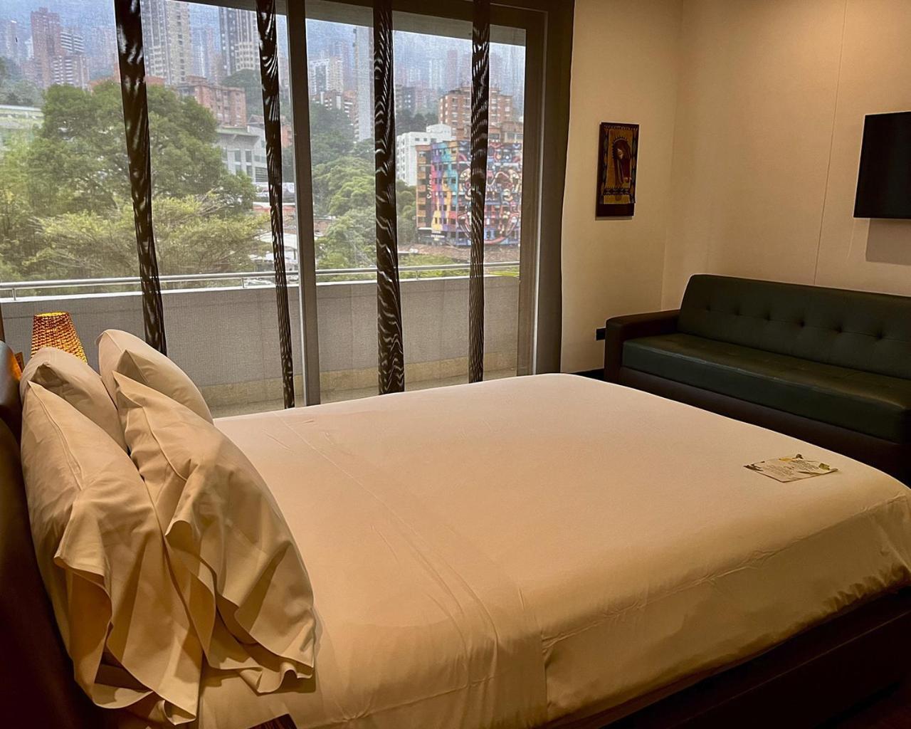 ディエス ホテル メデジン エクステリア 写真 A bedroom in the hotel